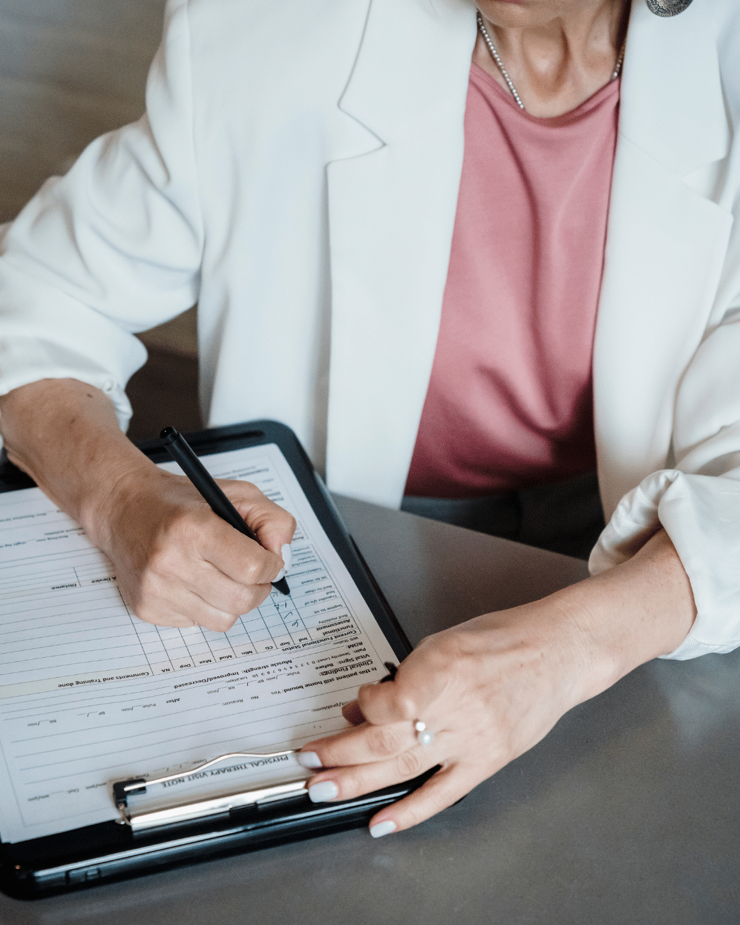 A psychiatric nurse providing medication management for mental health and medication for depression and anxiety with a patient during a consultation.