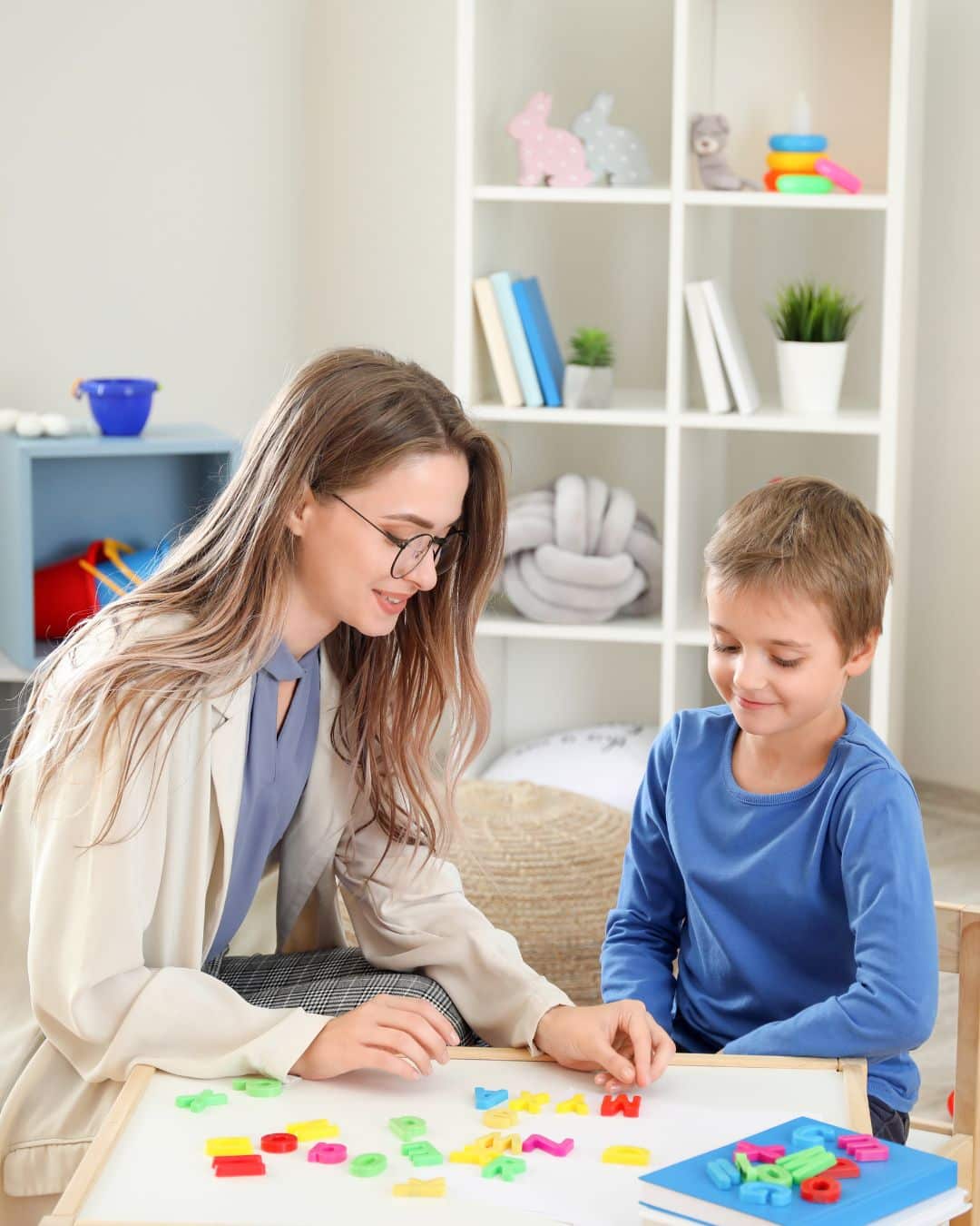 Pediatric therapist working with child.