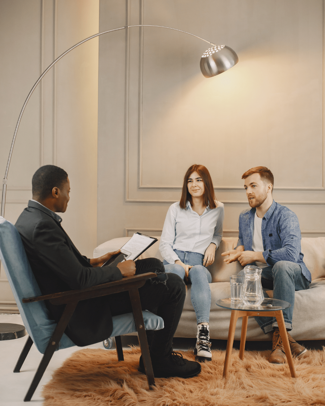 Couple sitting together during a relationship counseling session, receiving therapy for couples from a licensed therapist.