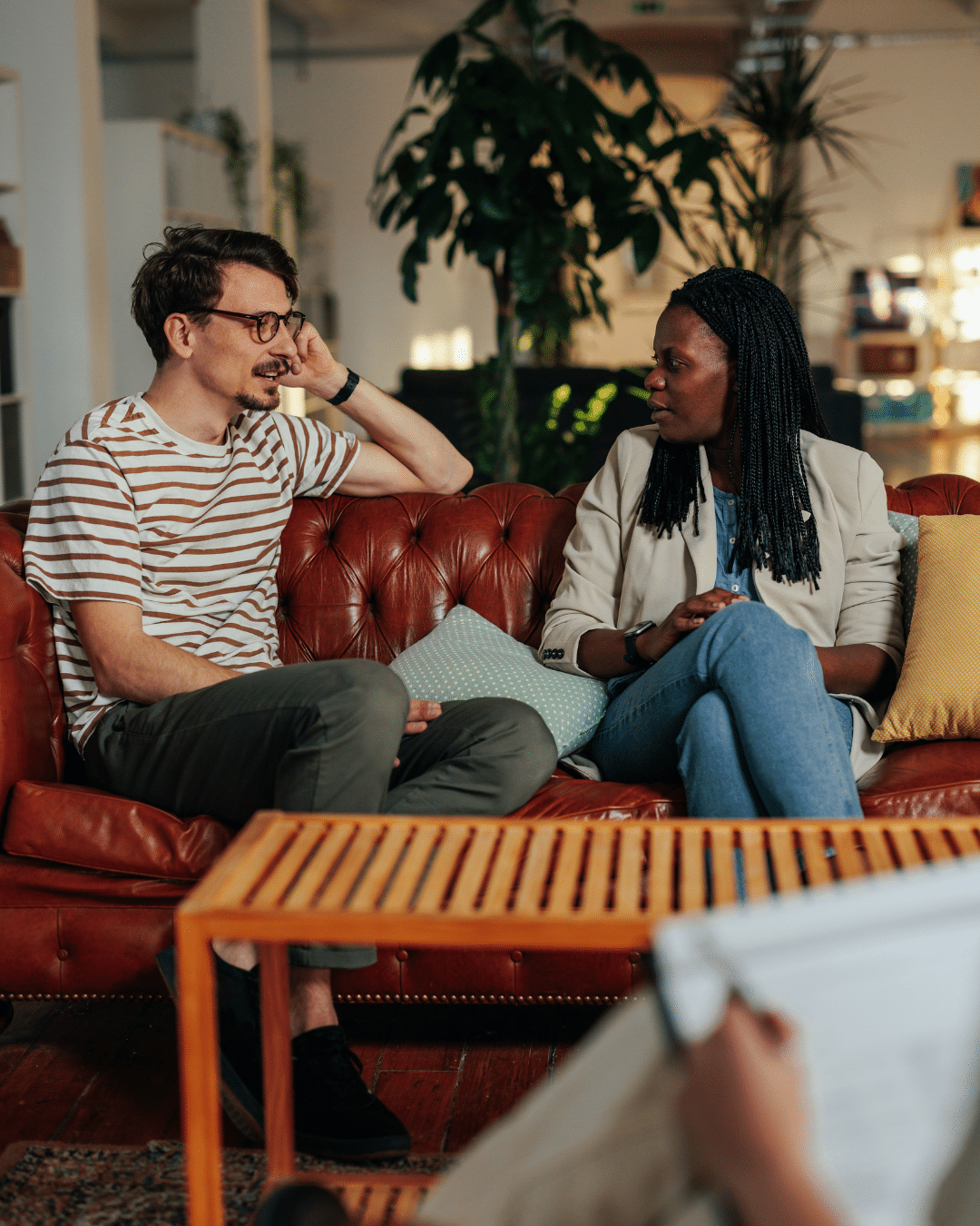 Two patients engaged in a stress therapy session focused on navigating major life transitions.